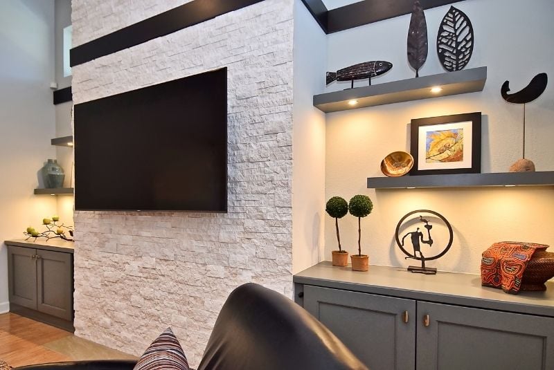 stone accent wall with decor shelves