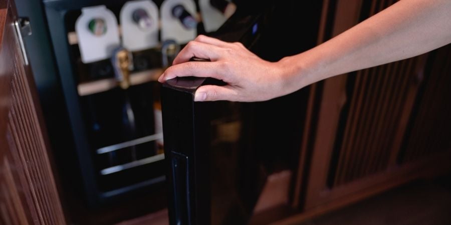 hidden wine fridge in kitchen cabinet