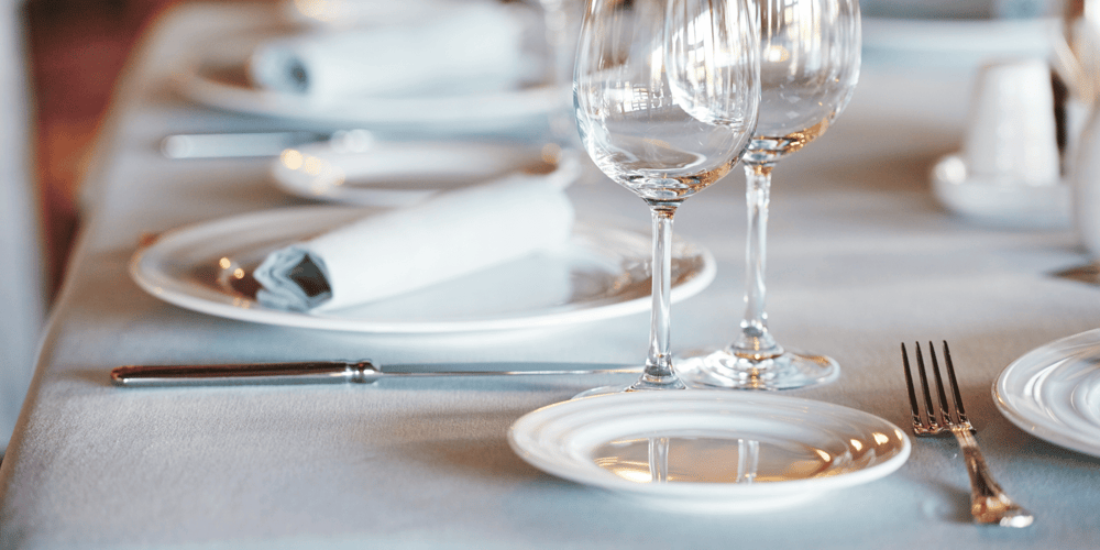 Stock Image of Table Set with Wine Glasses, Napkins, and Silverware in Upscale Lakewood Ranch Restaurant