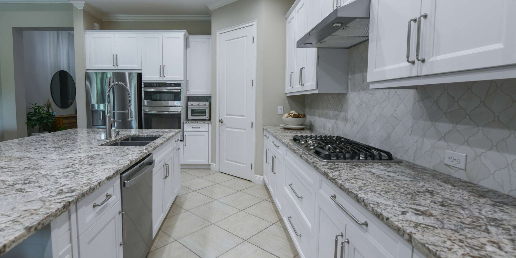 Kitchen cabinet refresh by Gilbert Express featuring white cabinets and granite countertops