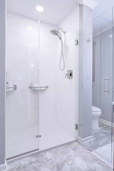 Bathroom remodel with glass shower enclosure and white tile walls by Gilbert Express Bathroom remodel with glass shower enclosure and white tile walls by Gilbert Express