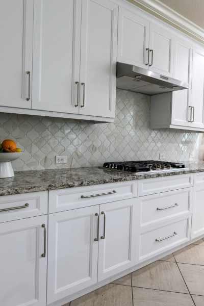 White cabinet refresh with granite countertops and modern backsplash by Gilbert Express White cabinet refresh with granite countertops and modern backsplash by Gilbert Express