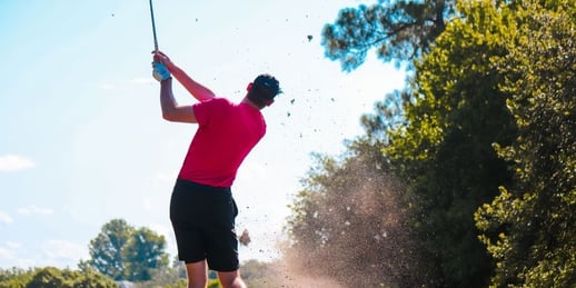 Golf Player Teeing Off