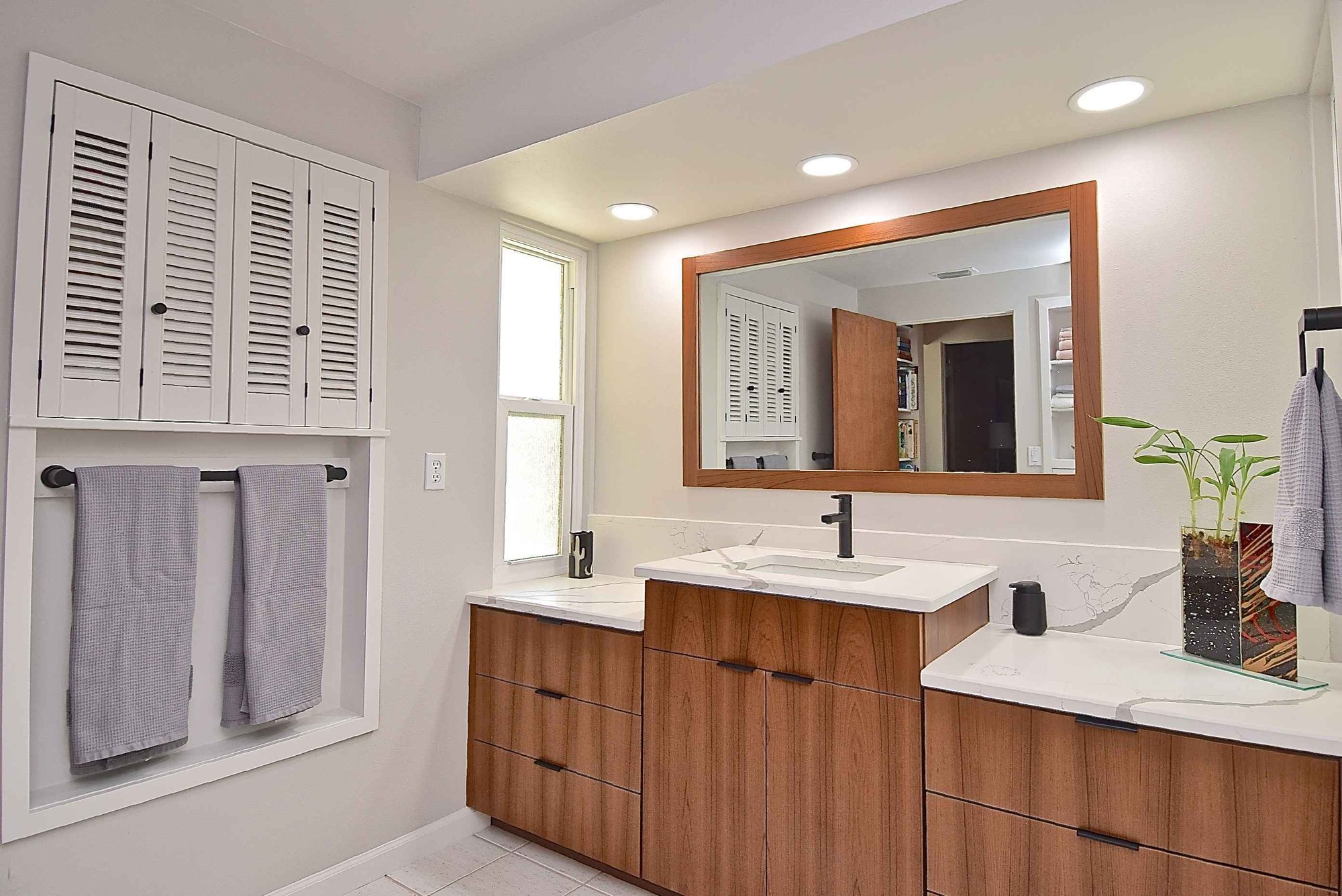 Wood Vanity with Marble Countertop in Remodeled Sarasota Primary Bathroom Wood Vanity with Marble Countertop in Remodeled Sarasota Primary Bathroom