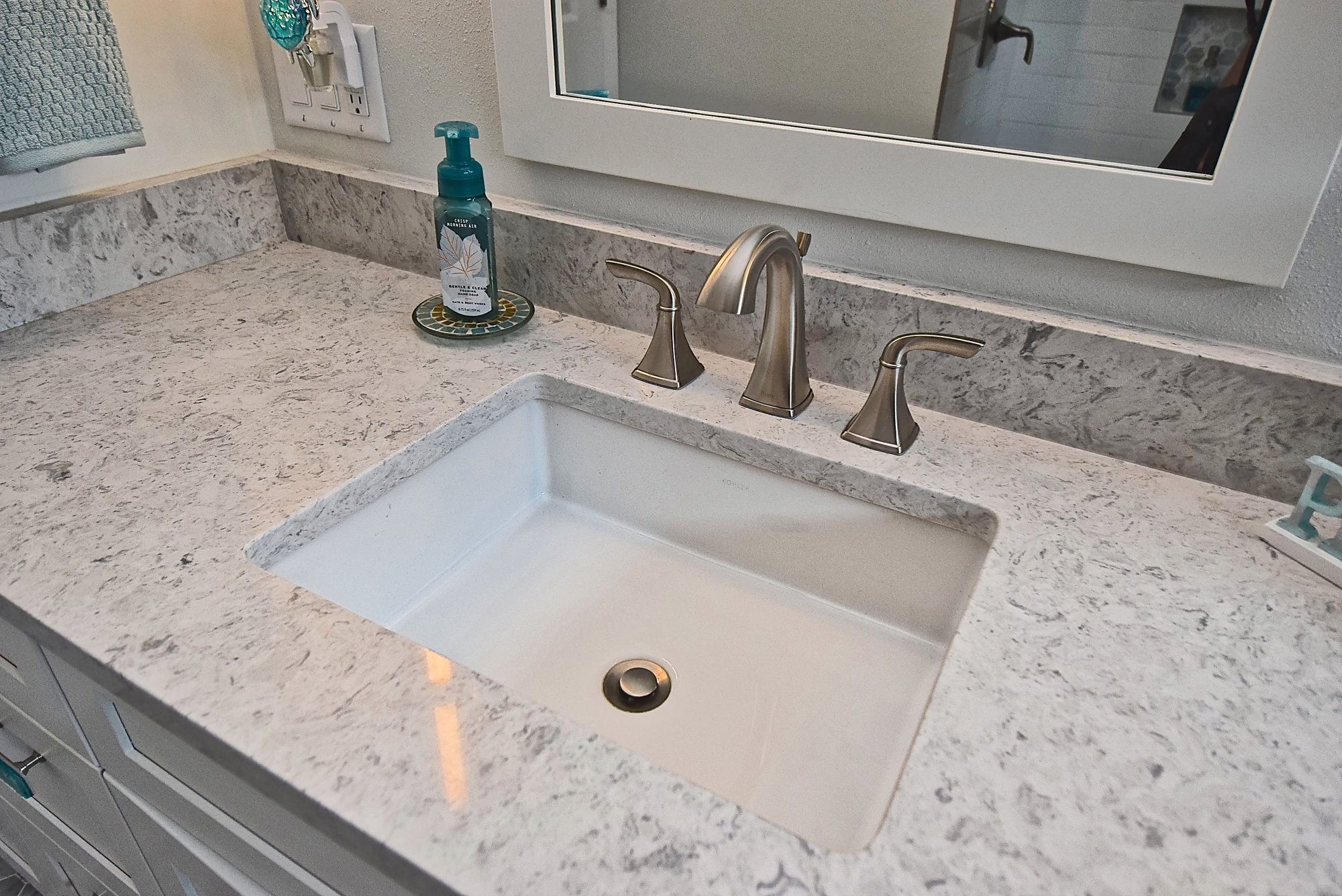 Brushed Metal Fixtures in Remodeled Sarasota Bathroom