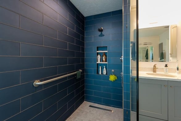 modern bathroom with blue shower tile