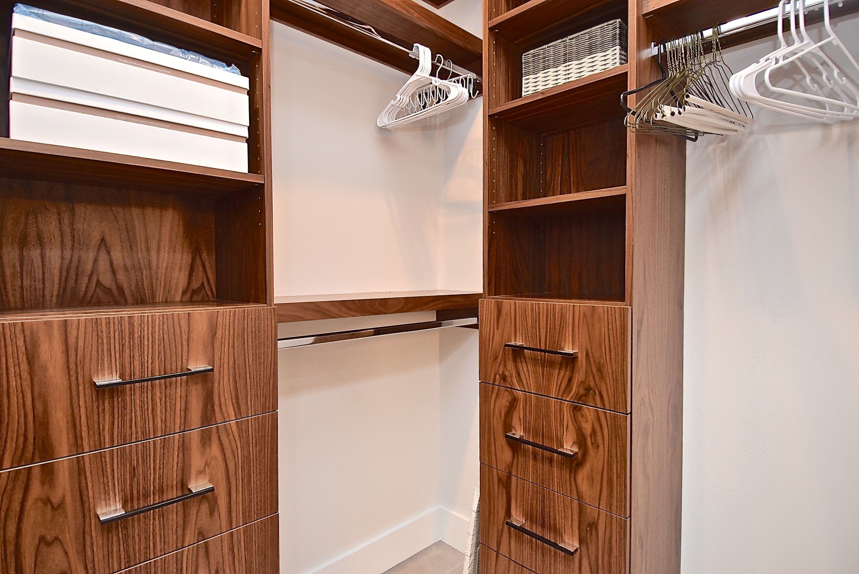 Walk in Closet with Wood Cabinetry in Bradenton Whole Home Remodel - Gilbert Design Build Sarasota Design-Build Remodeling Firm - Creative ways to Maximize Your Space with an ADU 