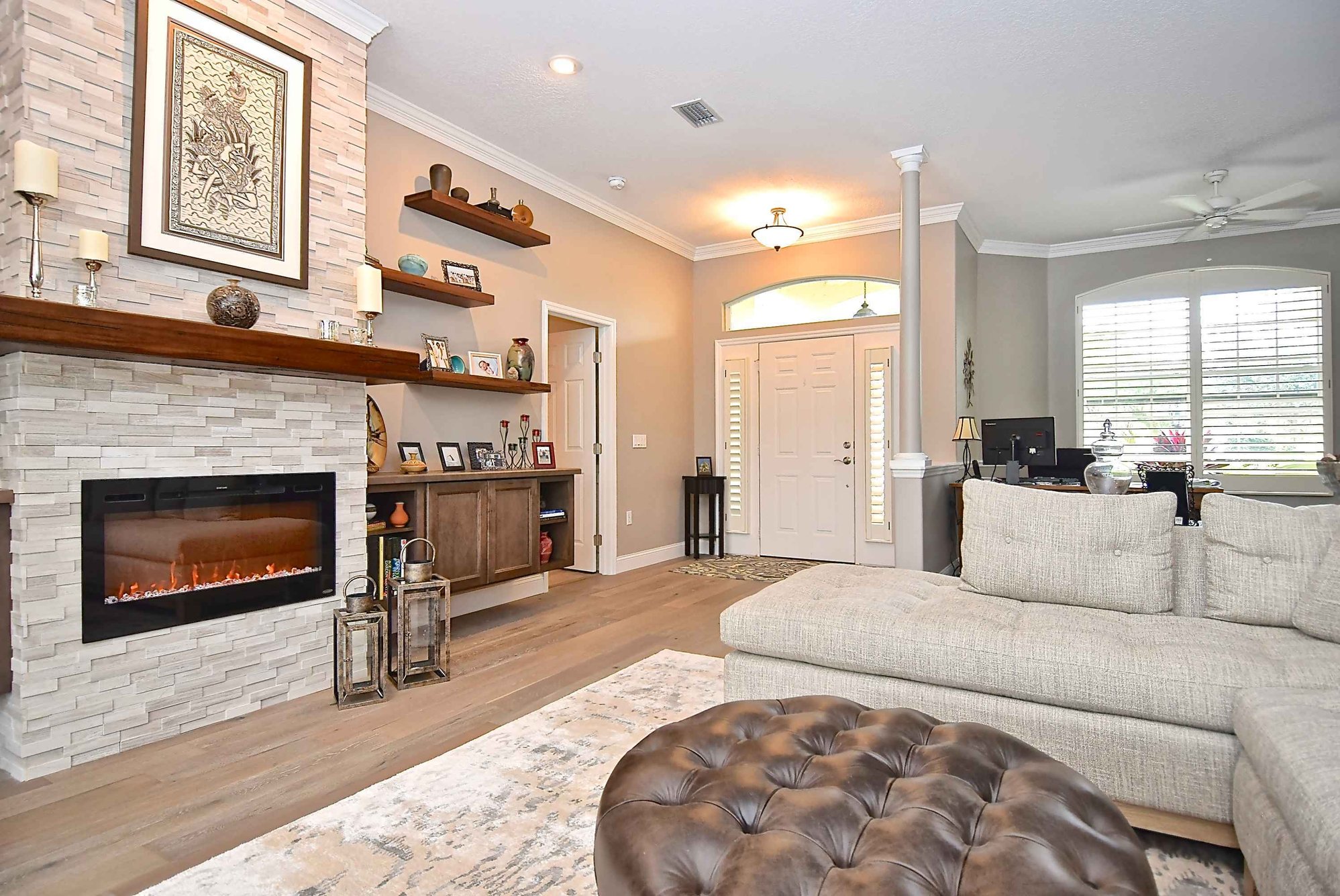 living room remodel with electric fireplace - Gilbert Design Build Sarasota Design-Build Remodeling Firm - The Most Important Questions For Hiring a Remodeling Contractor