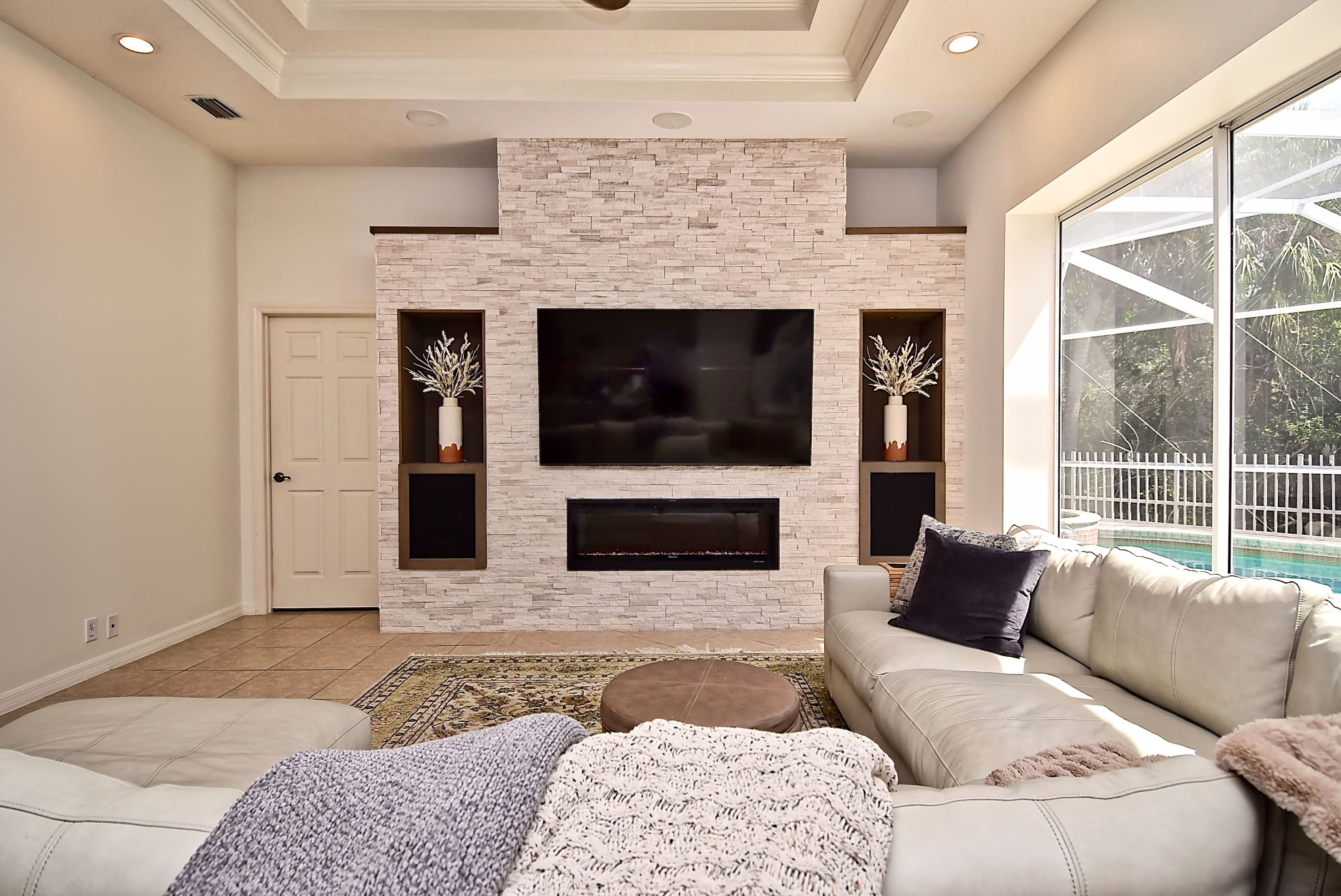 Bright Sarasota Living Room Feature Wall with Feature Wall and Built In Alcoves Interior Design