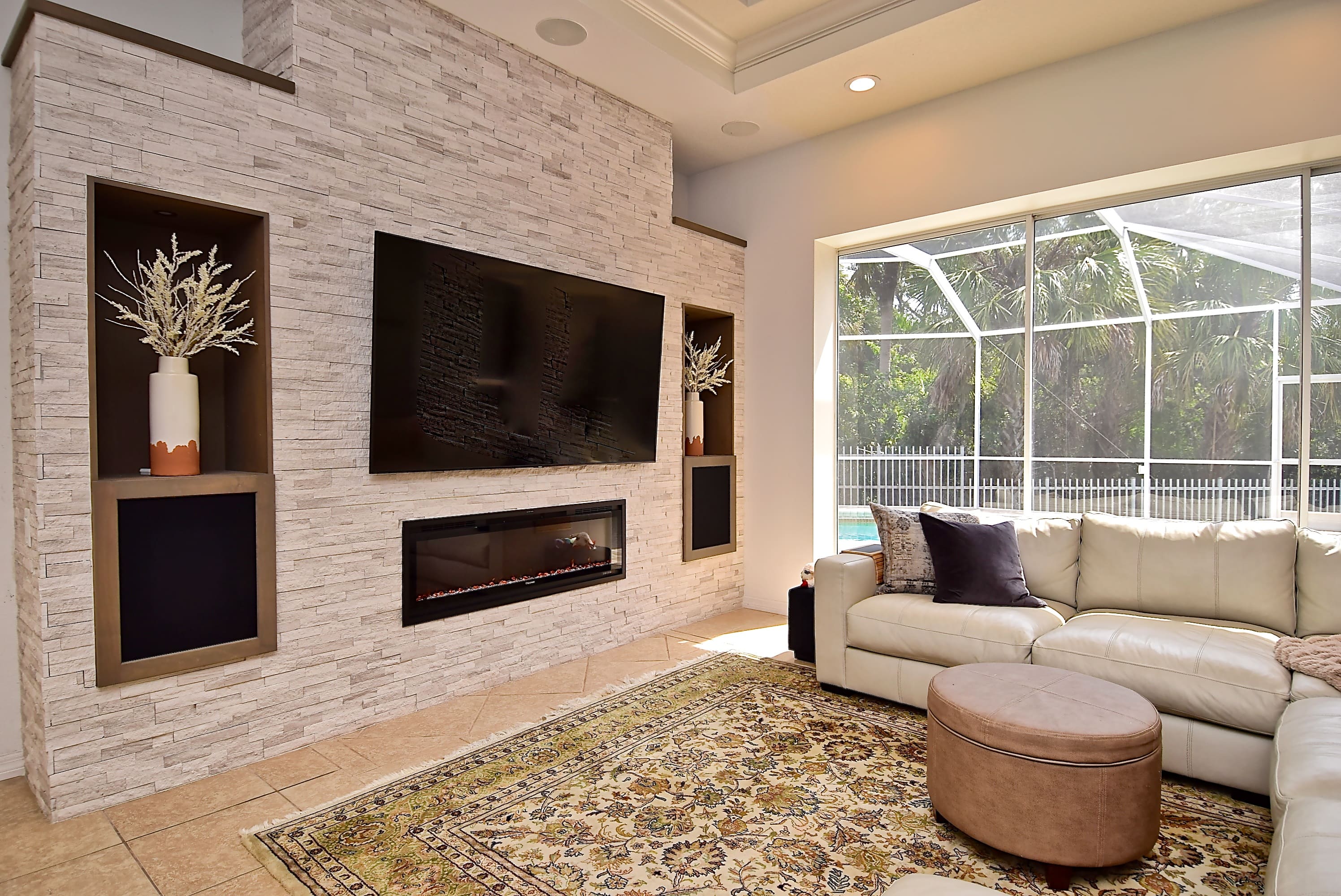 Feature Wall with Stacked Stone Fireplace in Sarasota Home Remodel with Built In Alcoves Interior Design Living Room