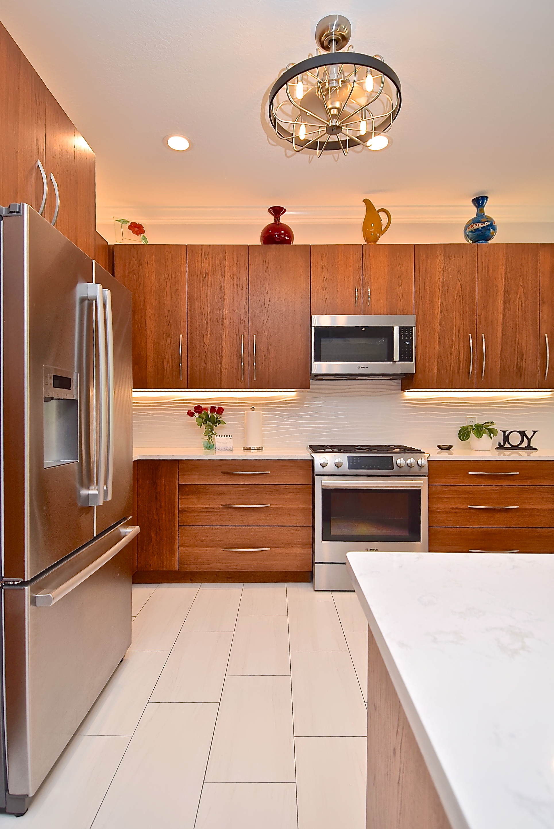 Mid Century Modern Kitchen Remodel in Sarasota Warm Wood Cabinets Stainless Steel Appliances