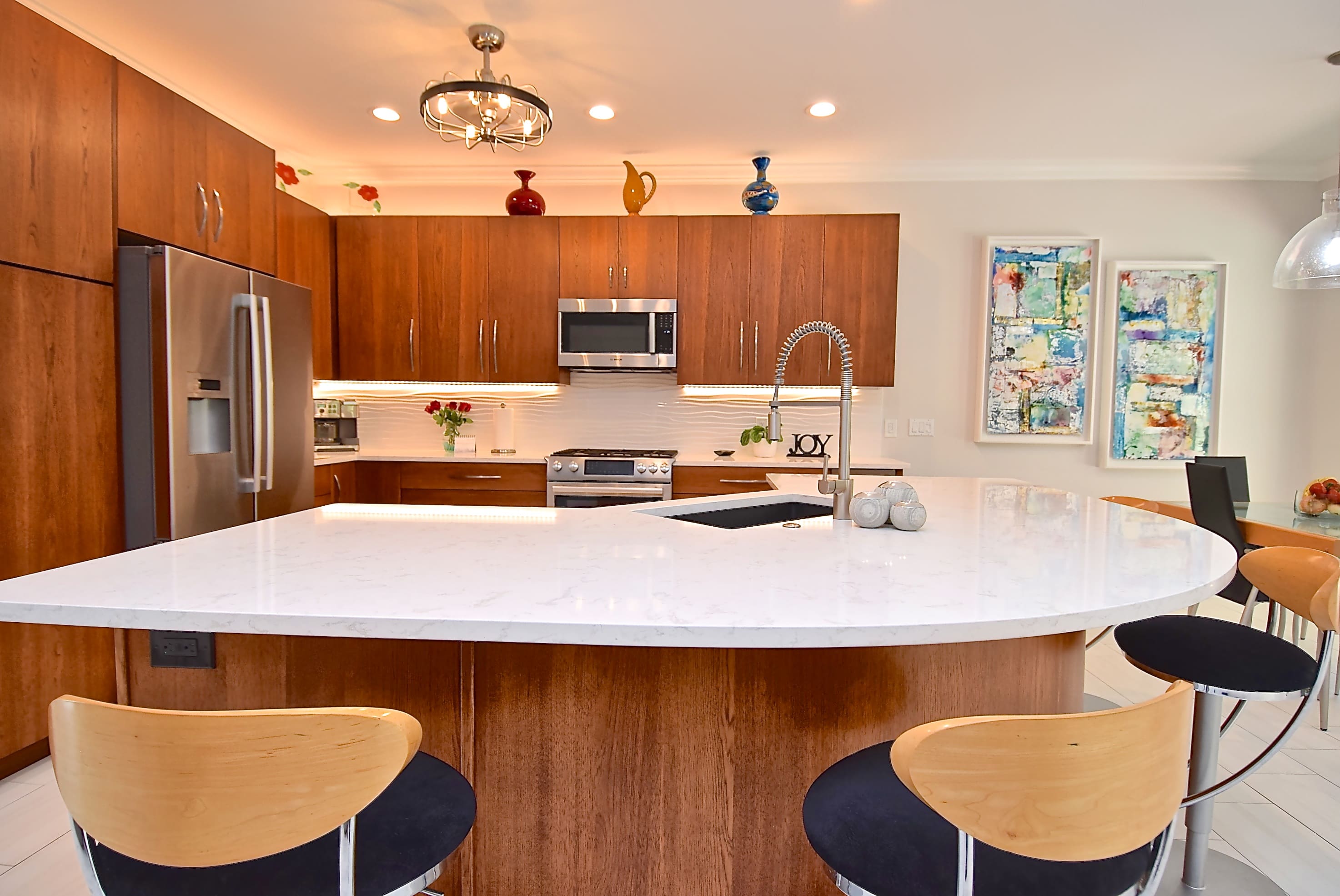 Mid Mod Kitchen Chairs in Curved Warm Wood Kitchen Remodel in Sarasota
