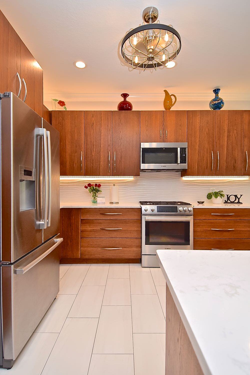  Mid Century Modern Kitchen Remodel in Sarasora Warm Wood Cabinets Stainless Steel Appliances Franz