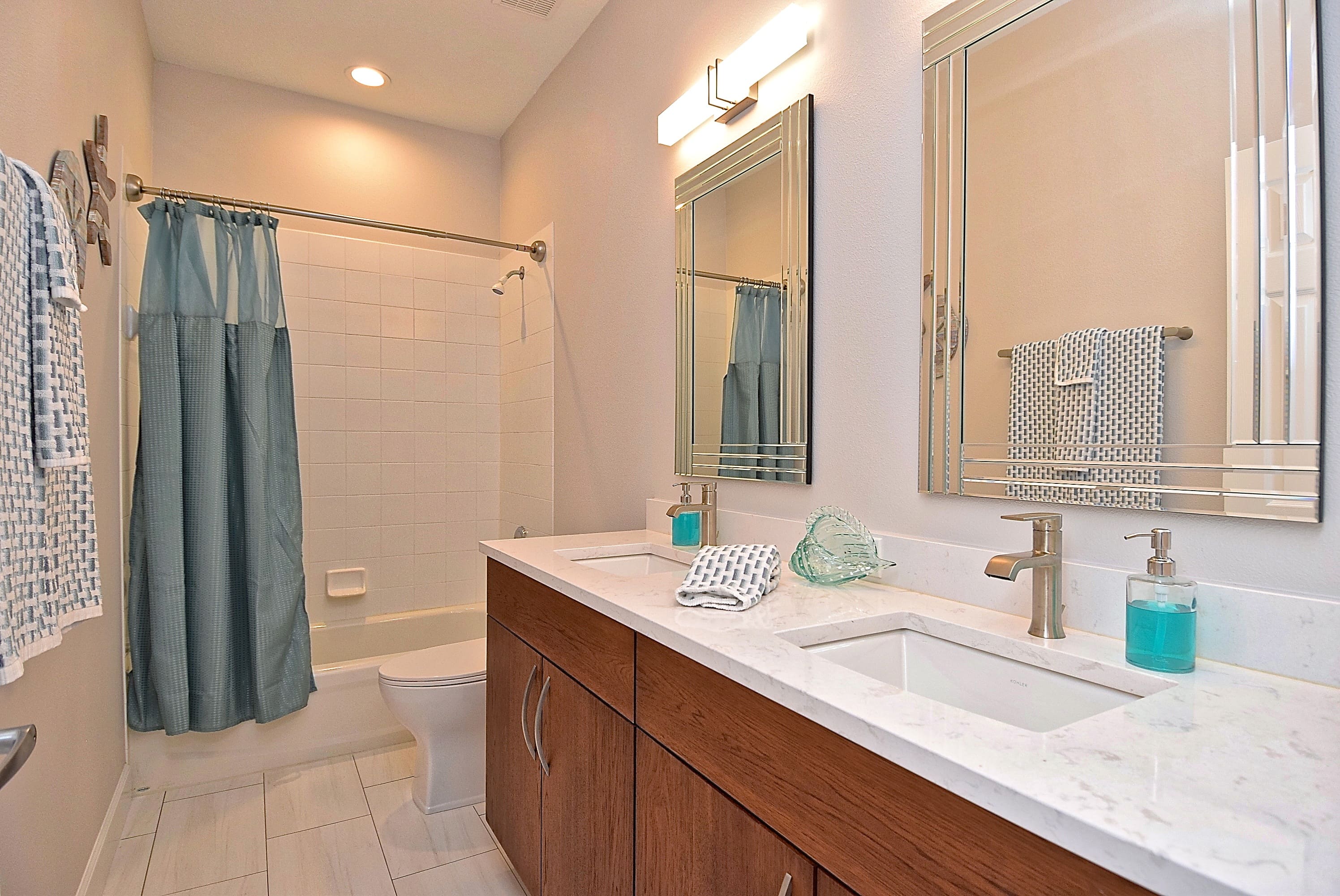 Mid Century Modern Bathroom Remodel in Sarasota Wood Vanity Tiled Shower