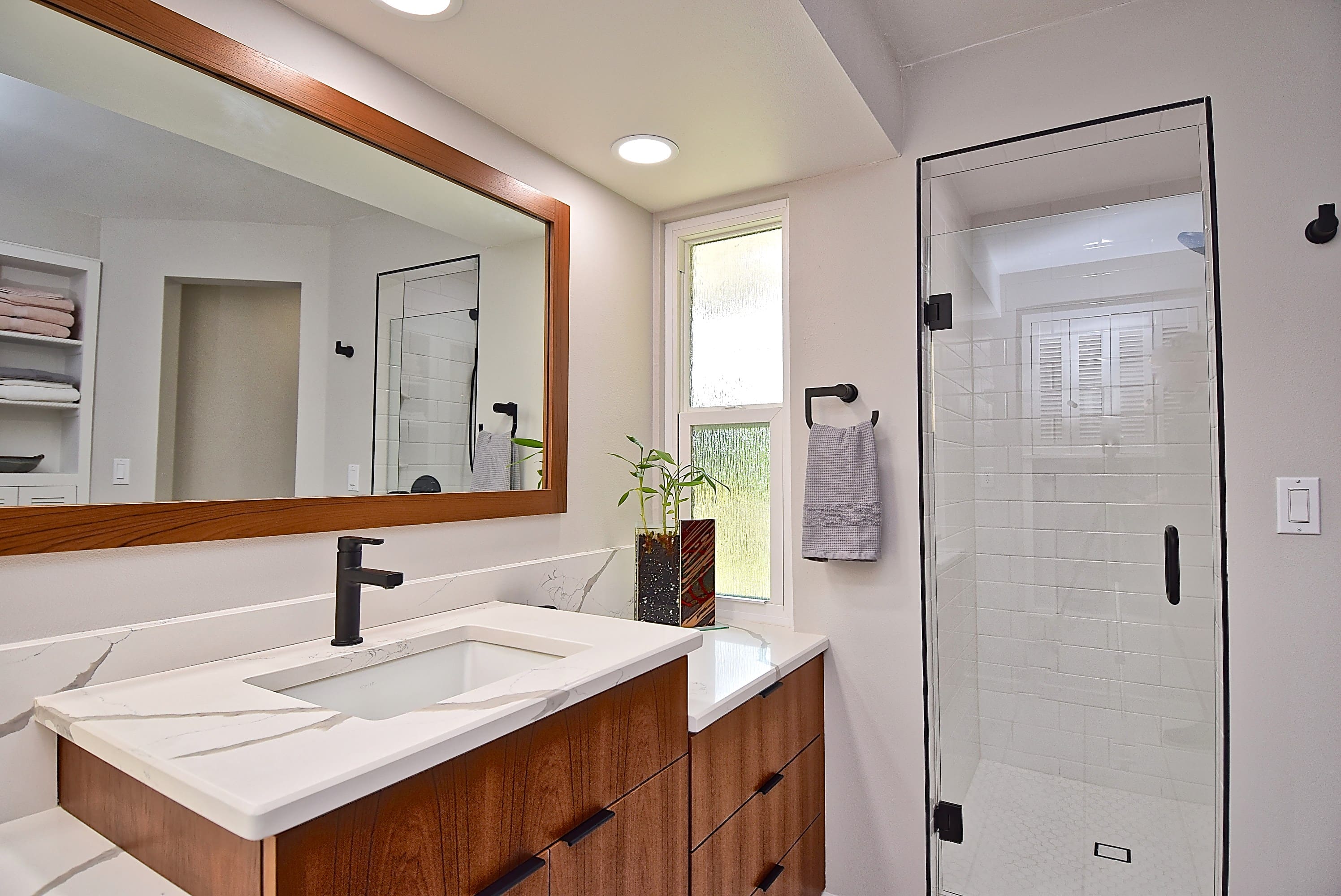 Marble Countertop in Remodeled Sarasota Primary Bathroom with Glass Shower Door Johnson