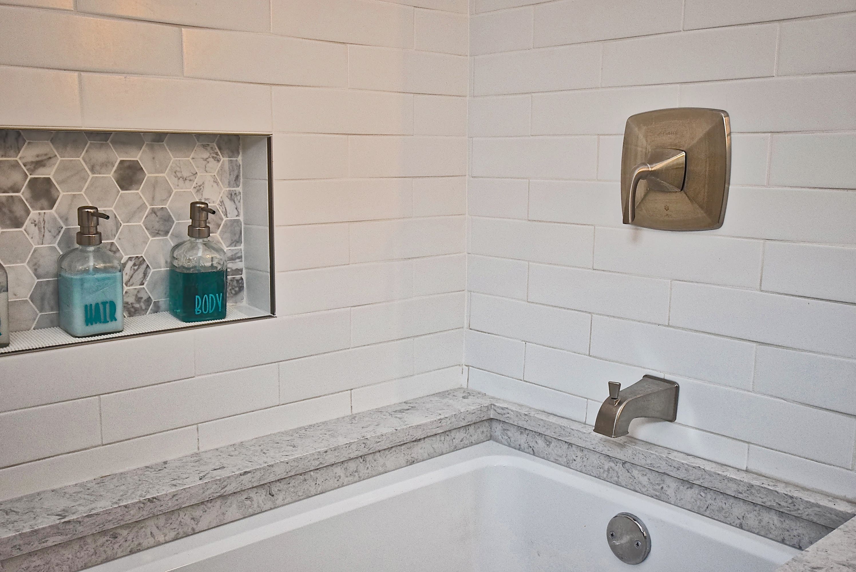 White Modern Elongated Subway Tile Tub Surround with Accent Niche in Sarasota Bathroom Remodel