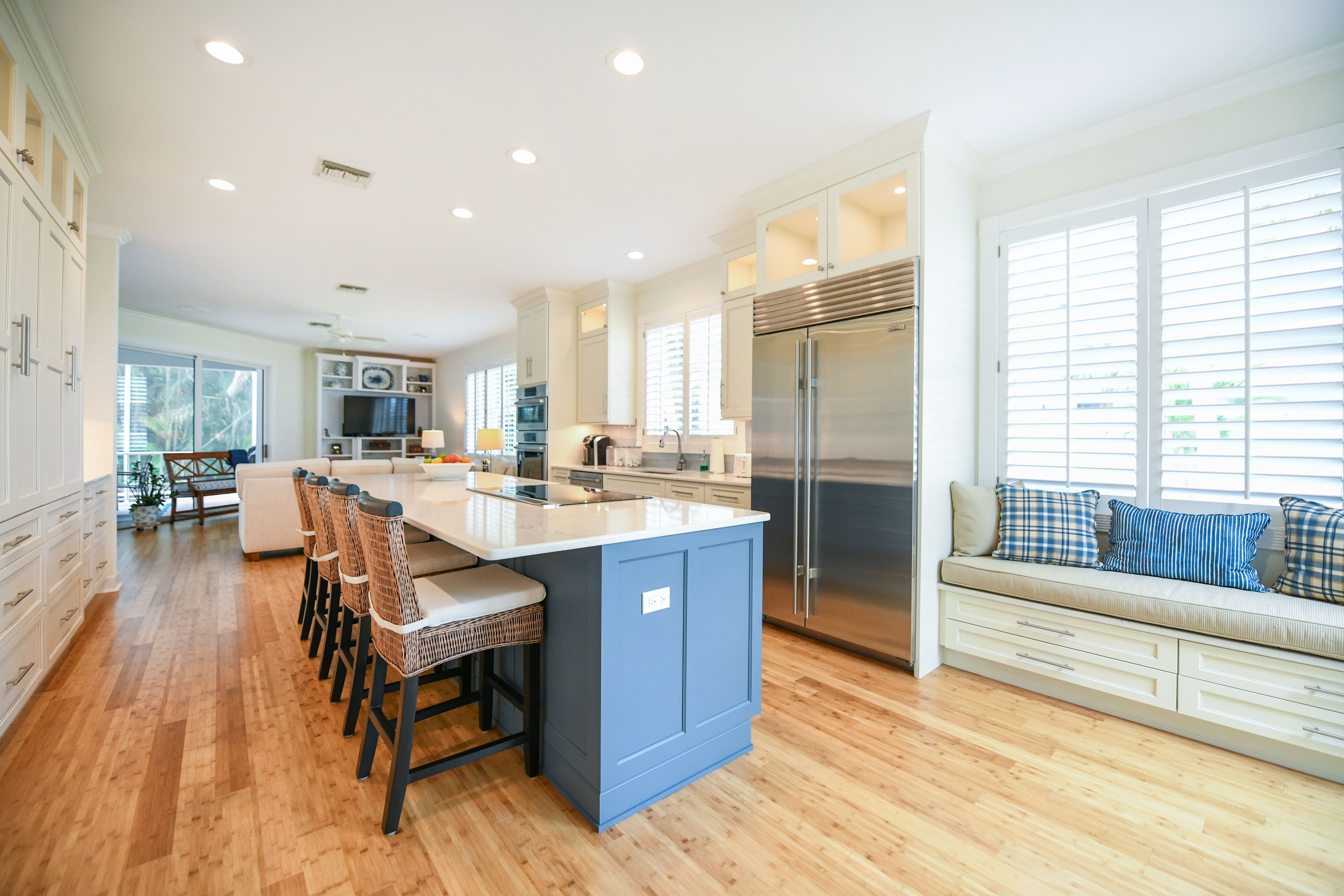 Industrial Appliances in Renovated Sarasota Kitchen with Window Seat and Blue Island Packard