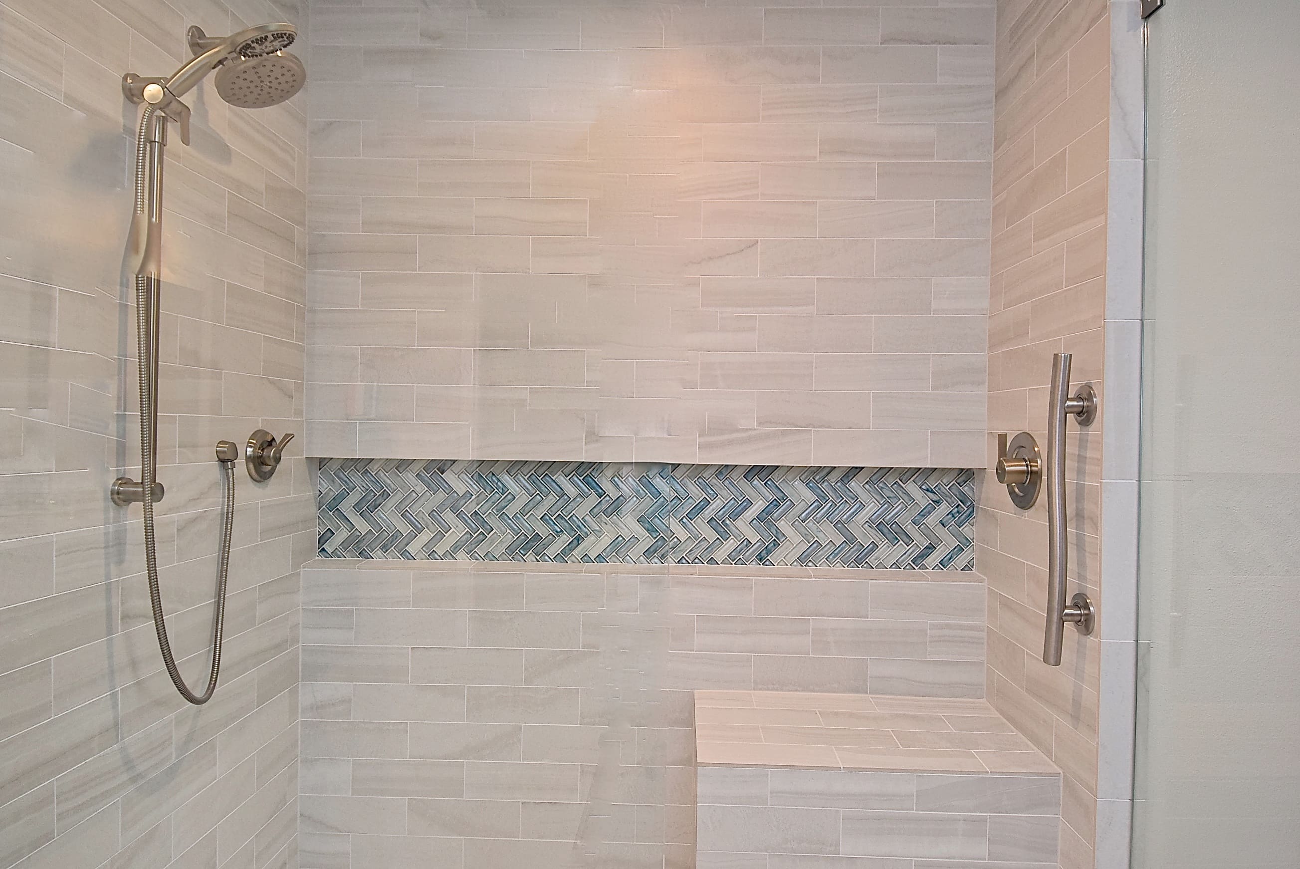 Custom Niche in ADA Bathroom Renovation in Bradenton with Grab Bars in Tiled Level Entry Shower