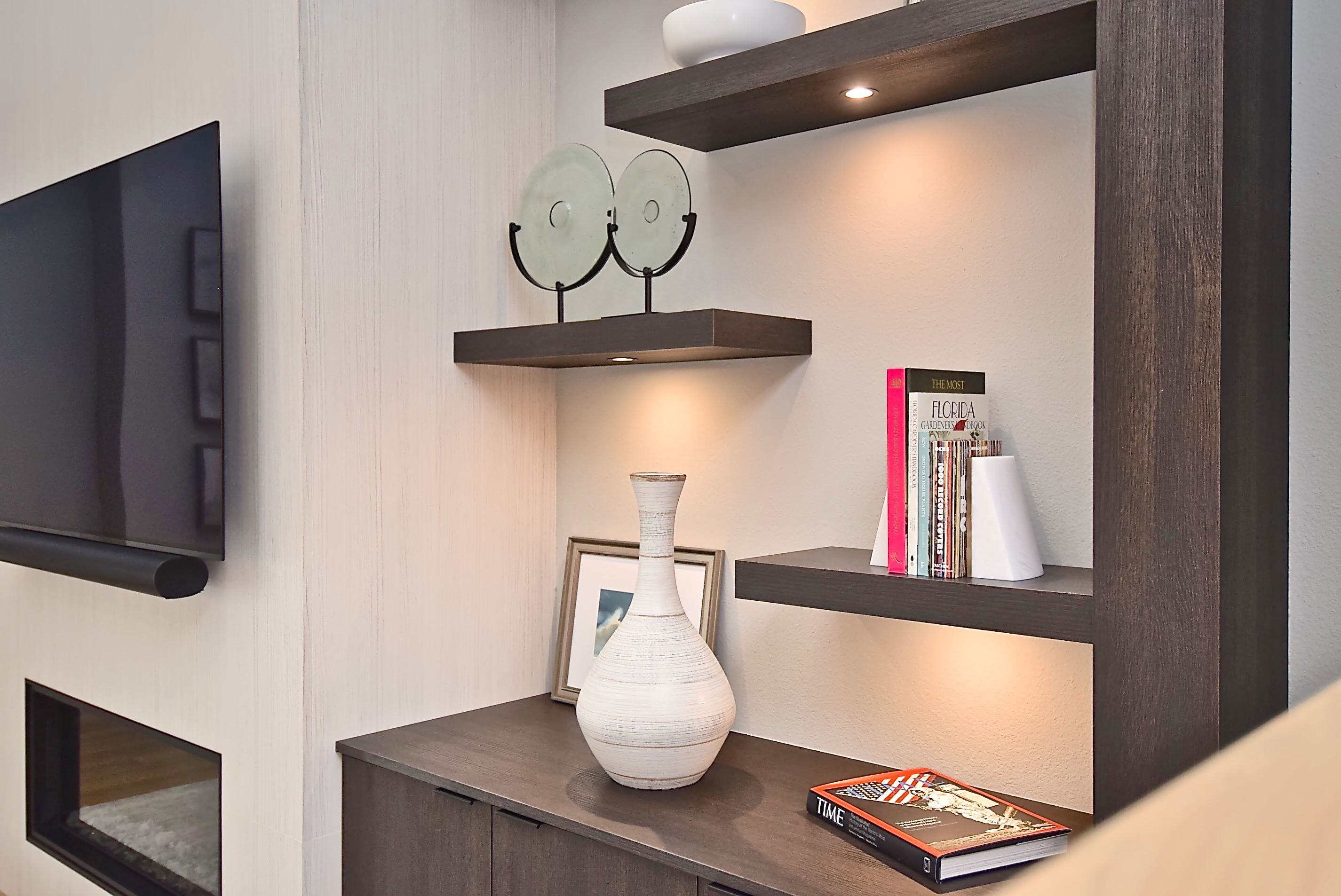 Custom Shelf with Built In Down Lighting on Feature Wall in Bradenton Home Remodel