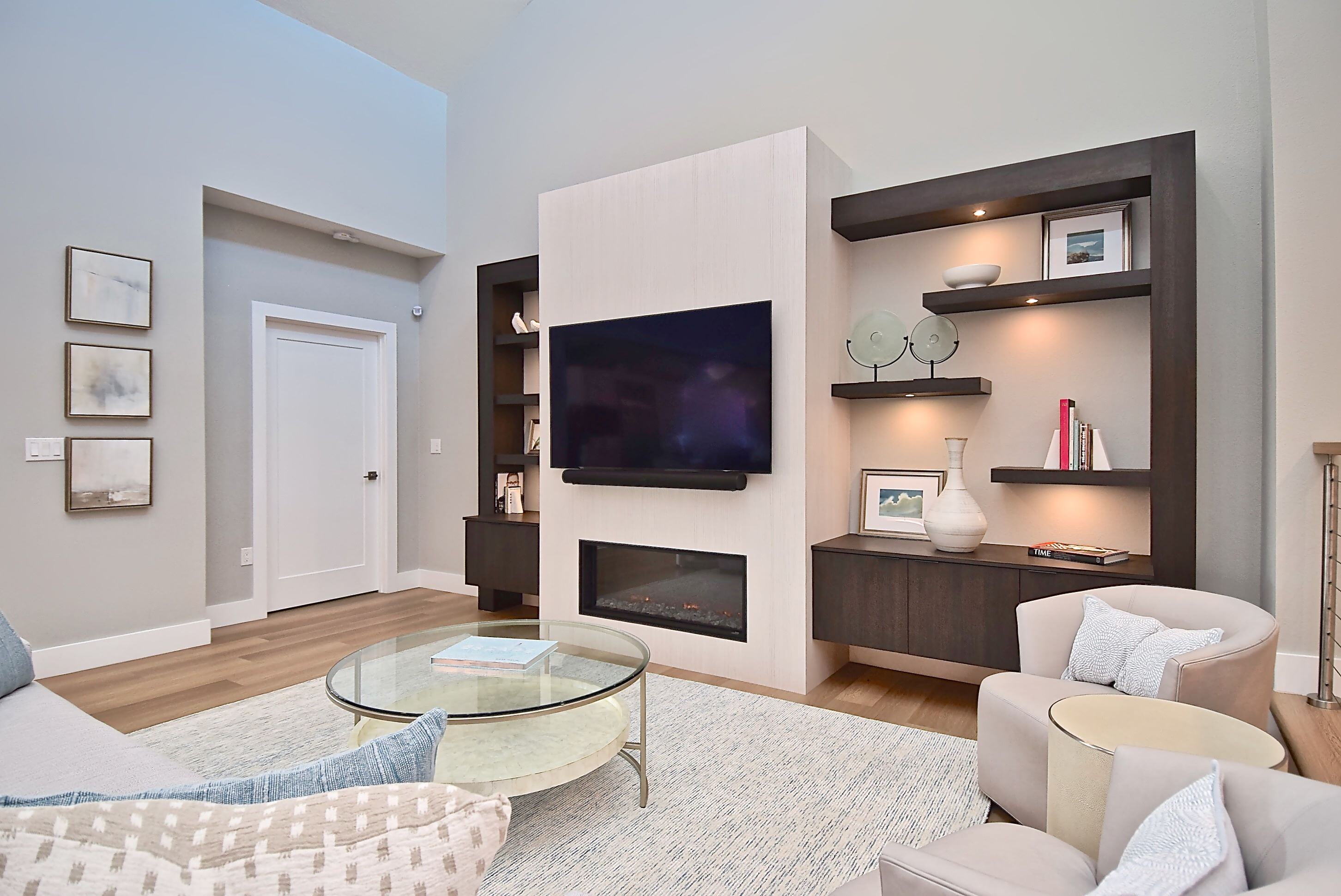 Living Room with Feature Wall and Custom Shelving Around Fireplace in Bradenton Whole Home Remodel