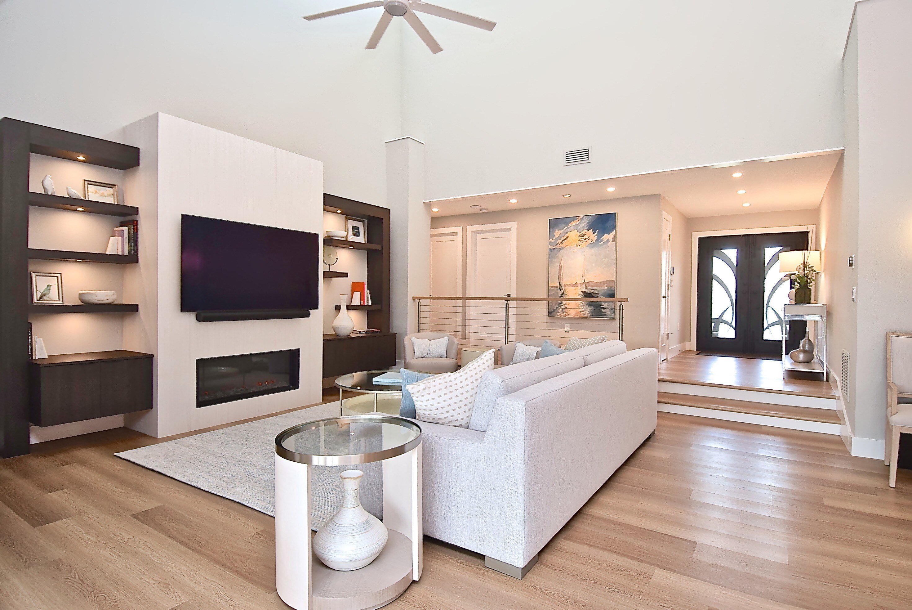 Modern Coastal Whole Home Remodel in Bradenton with Fireplace Feature Wall