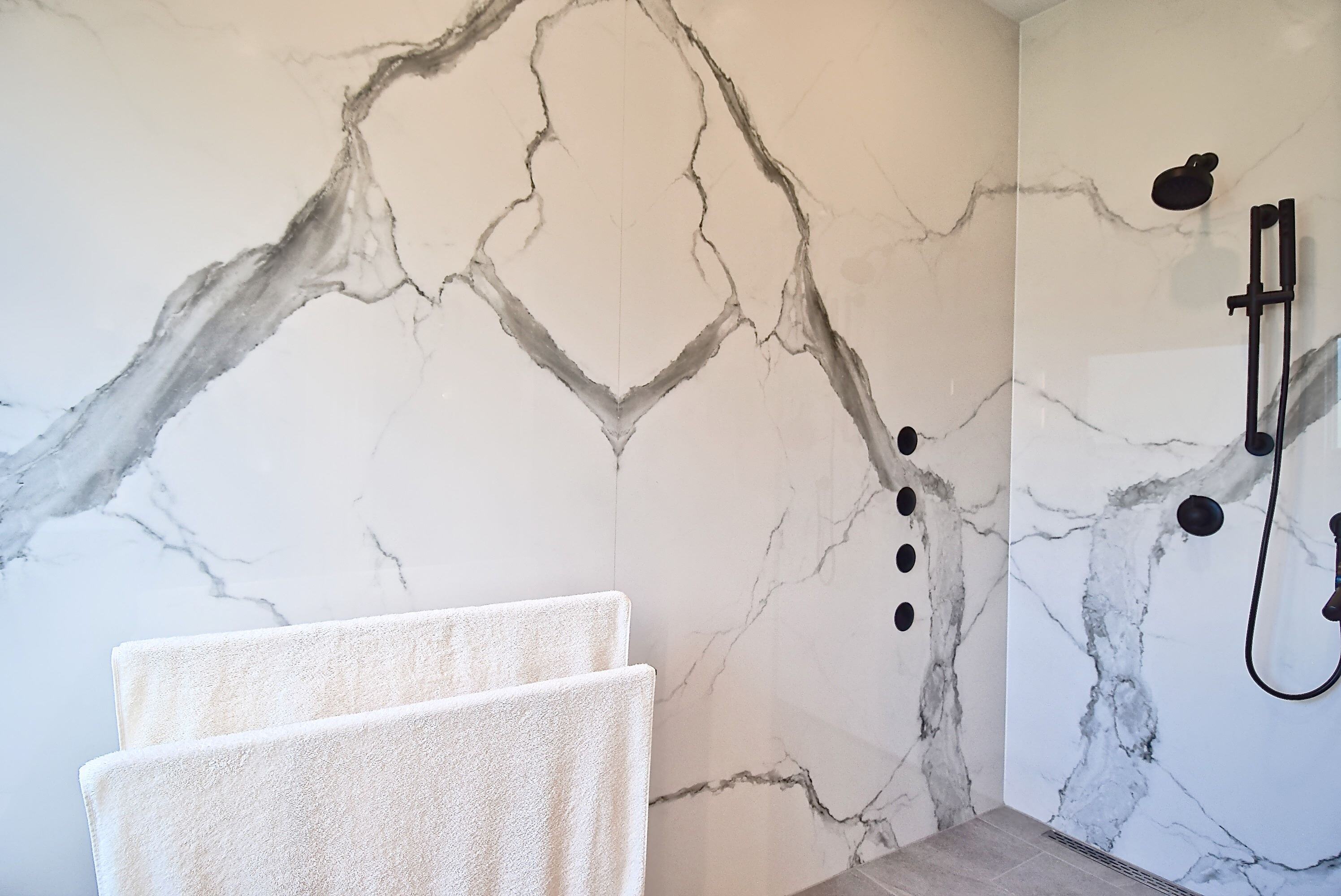 Modern Luxury Level Entry Tiled Shower with Book Matched Large Panel Porcelain Panels in Bradenton Home Remodel